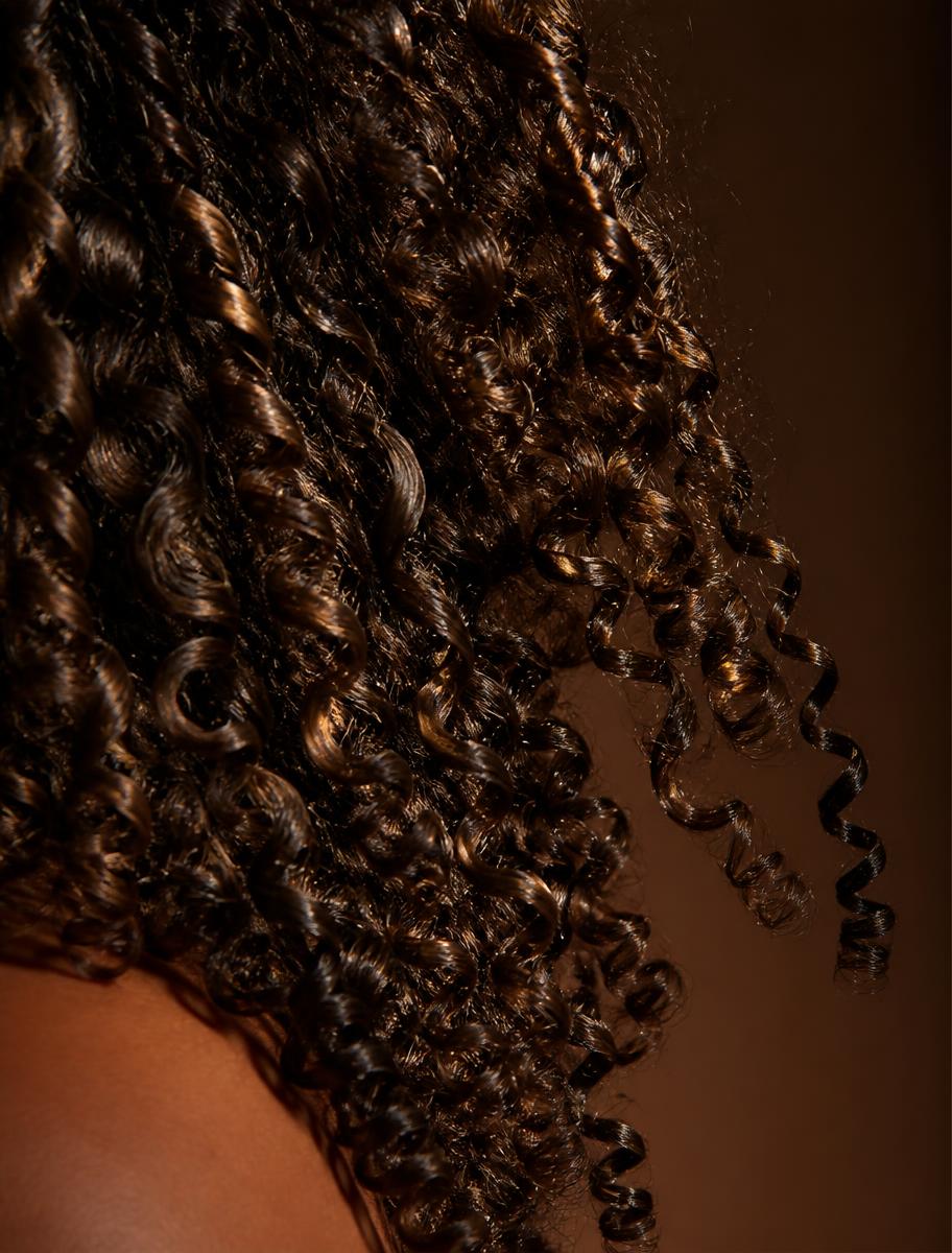Macro detail of glossy defined curl texture